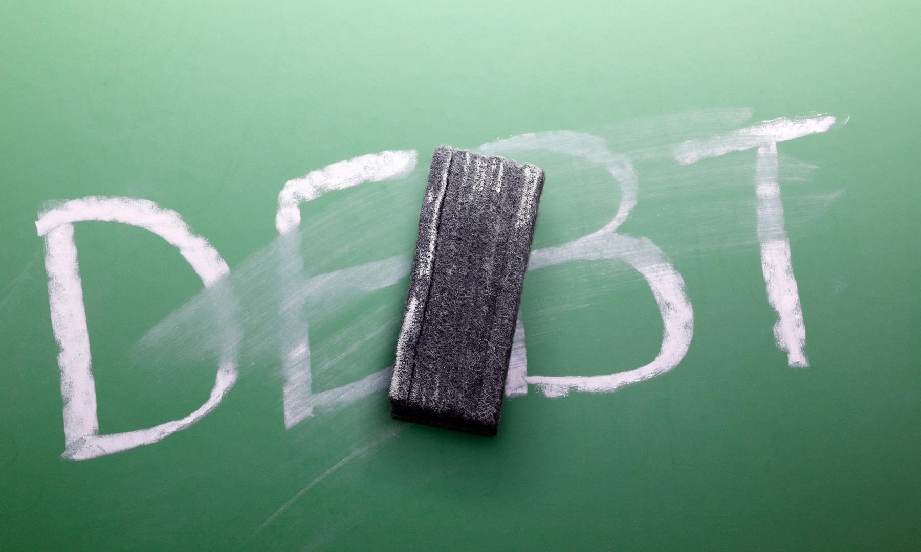 A chalkboard with the work debt being erased